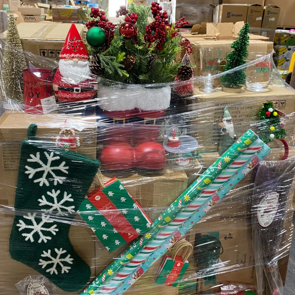 Holiday items liquidation pallet with Christmas decorations, Halloween décor, seasonal lights, gift wrap, and holiday accessories