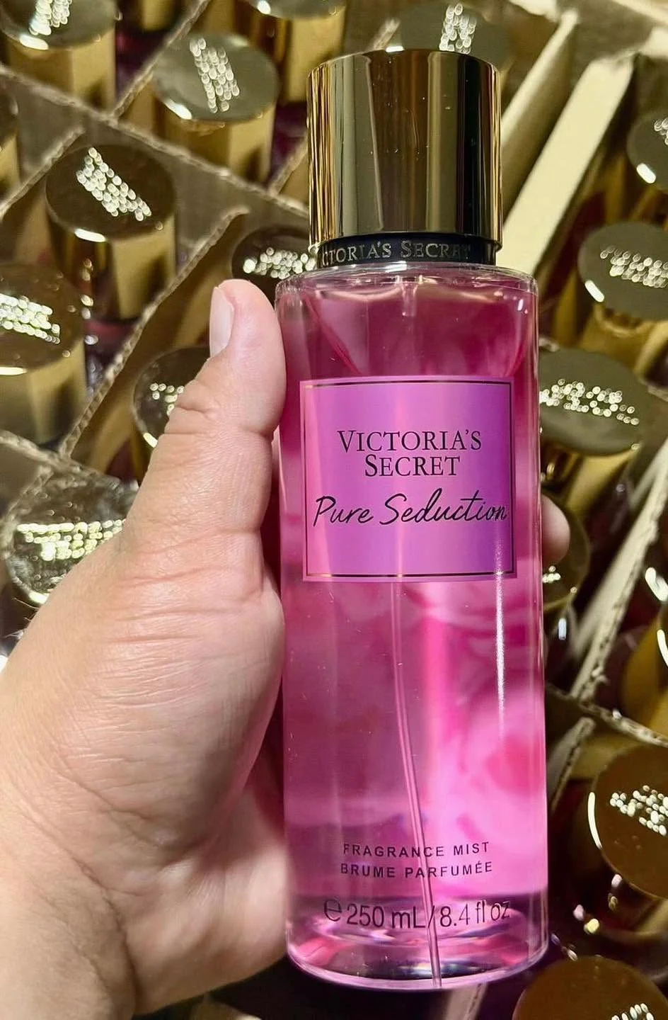 Wholesale fragrance liquidation pallet with assorted perfume bottles and body mists