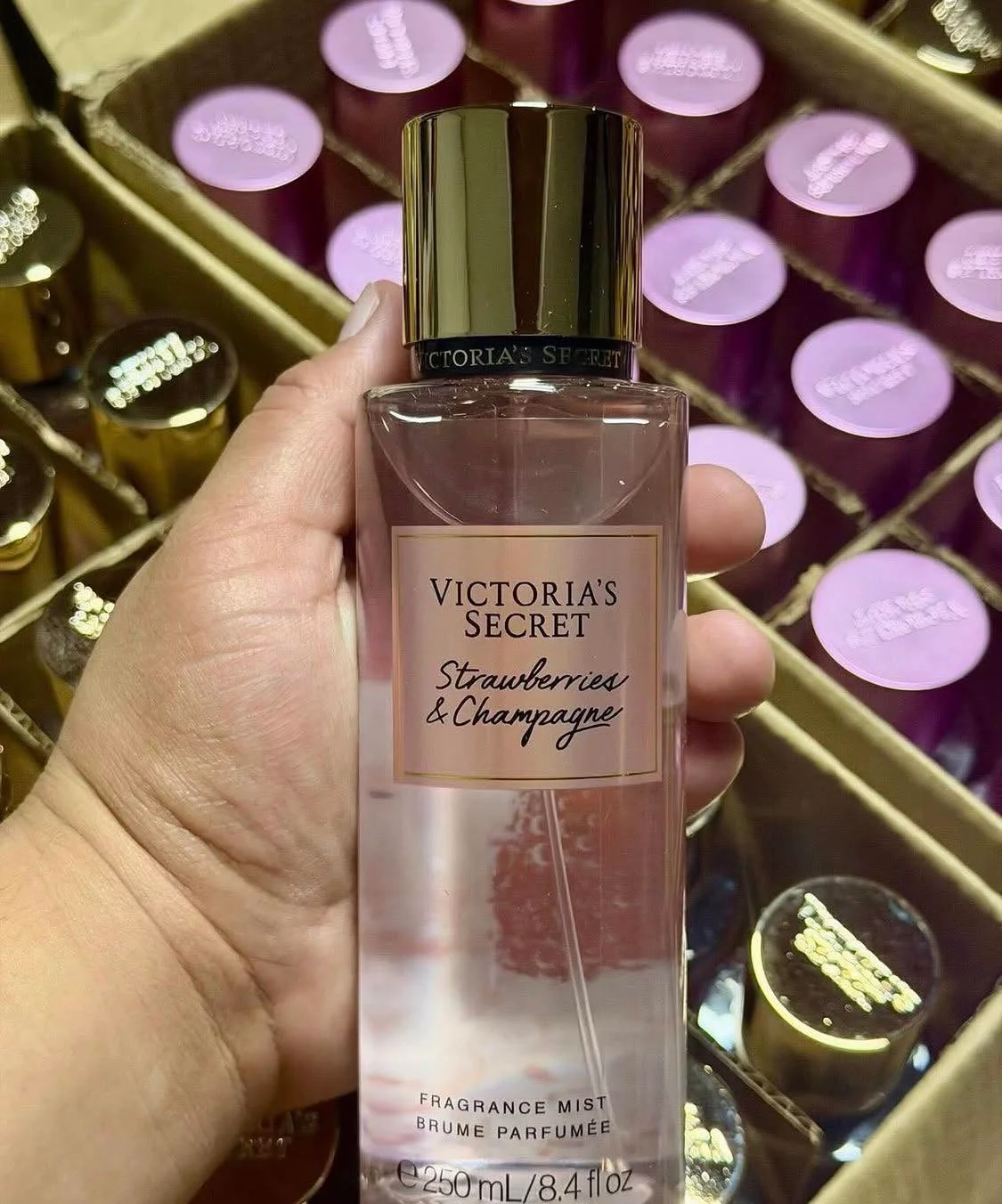 Wholesale fragrance liquidation pallet with assorted perfume bottles and body mists