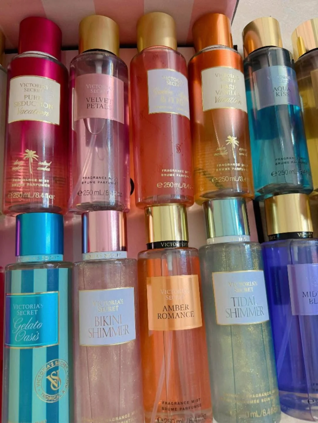 Wholesale fragrance liquidation pallet with assorted perfume bottles and body mists
