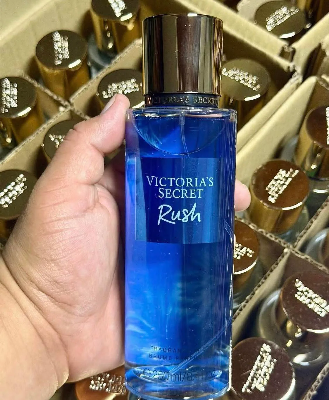 Wholesale fragrance liquidation pallet with assorted perfume bottles and body mists