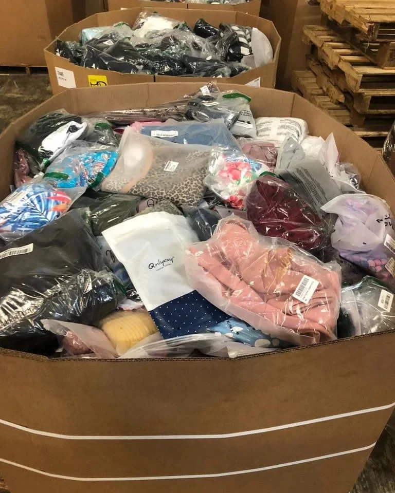 Branded apparel liquidation pallet with assorted wholesale clothing for resale