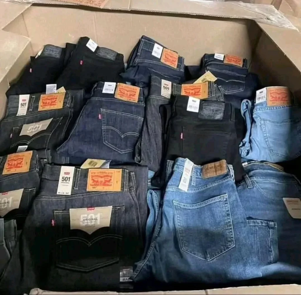 Wholesale branded jeans pallet containing approximately 300 assorted overstock denim pieces