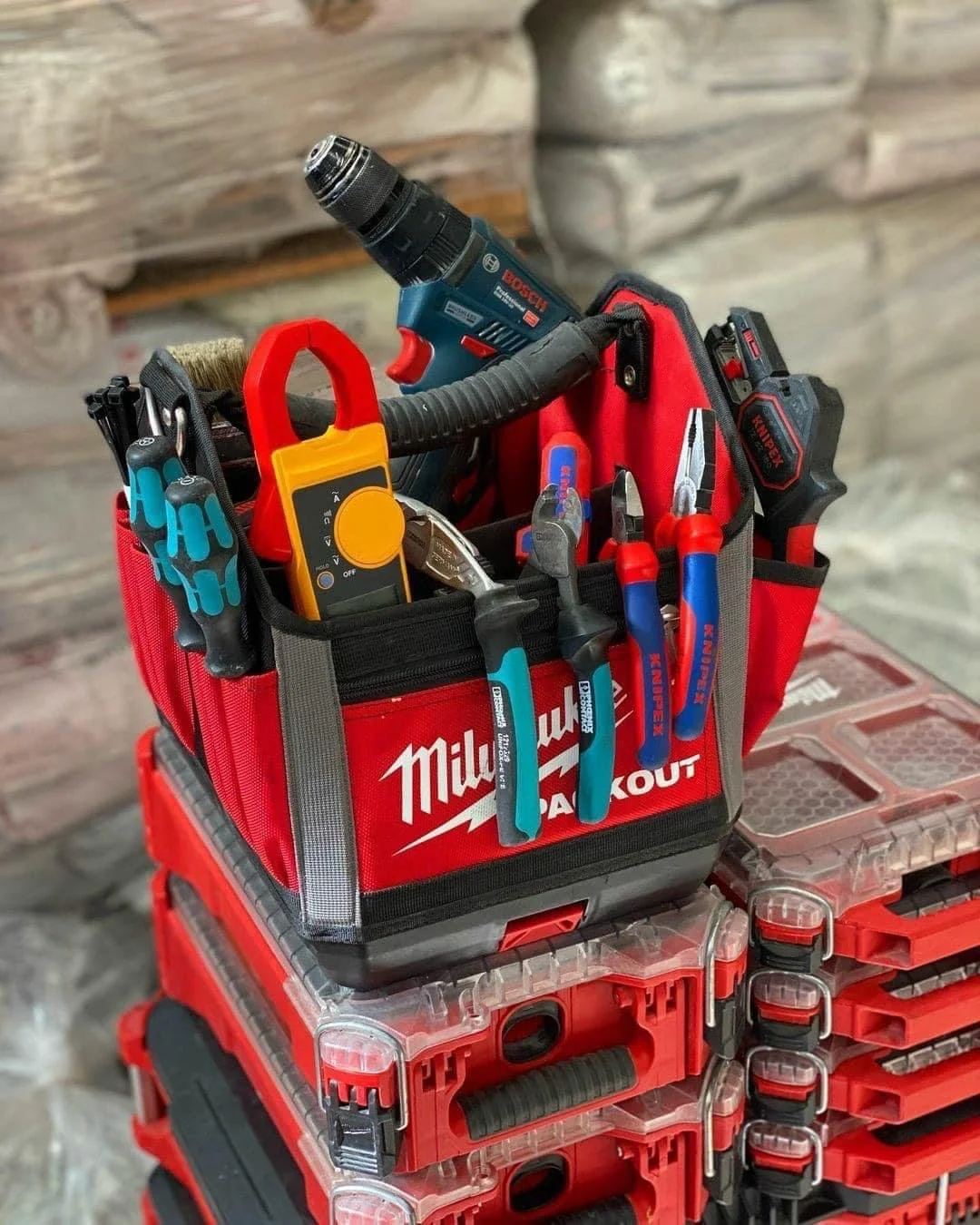 Wholesale Milwaukee tool assortment with batteries, chargers, work lights, and power-tool accessories.