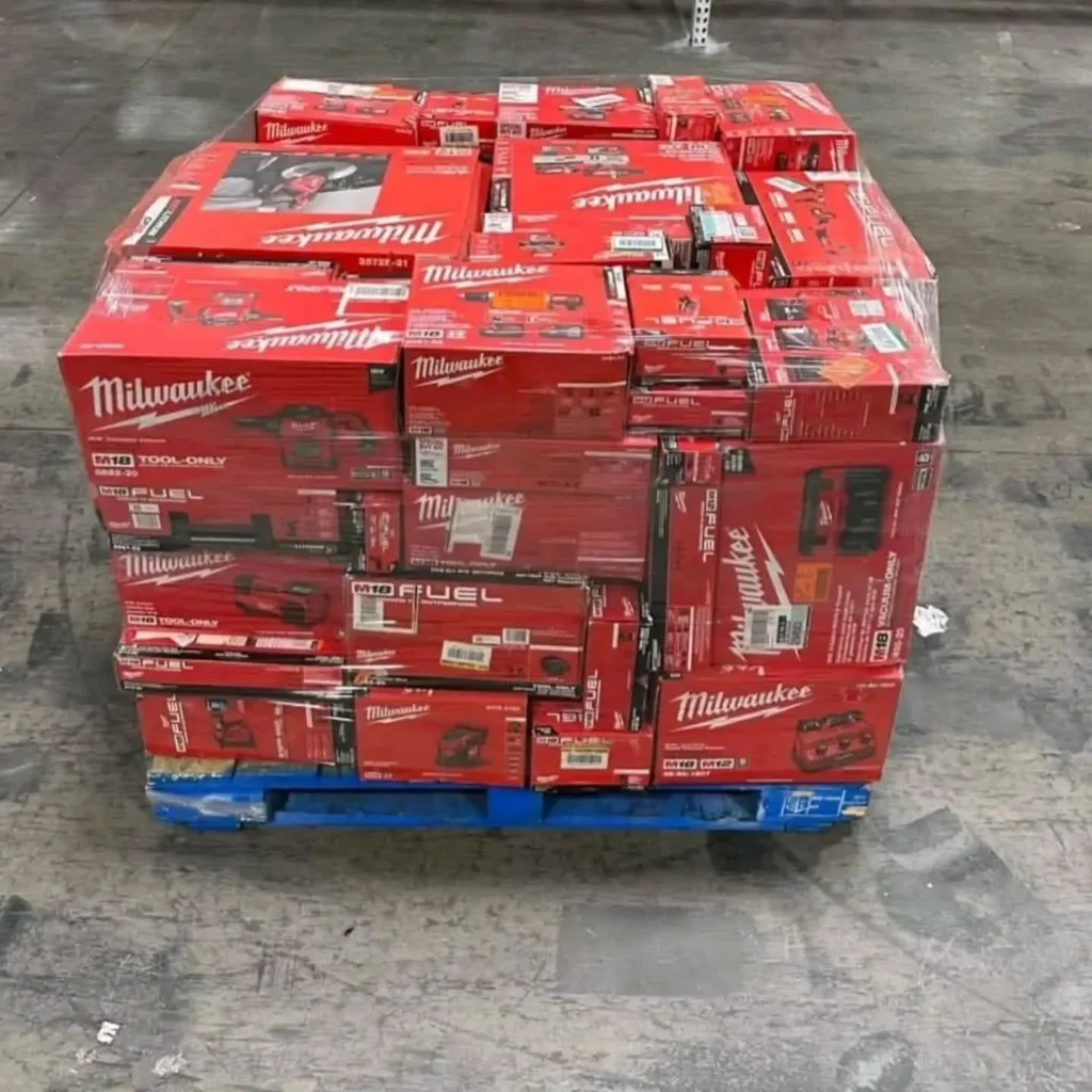 Milwaukee tool pallet featuring assorted cordless drills, impact drivers, saws, and power tools