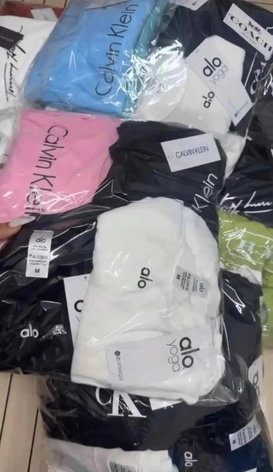 Yoga and athleisure clothing liquidation pallet with leggings, sports bras, tops, and joggers