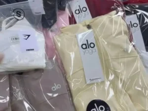 Yoga and athleisure clothing liquidation pallet with leggings, sports bras, tops, and joggers