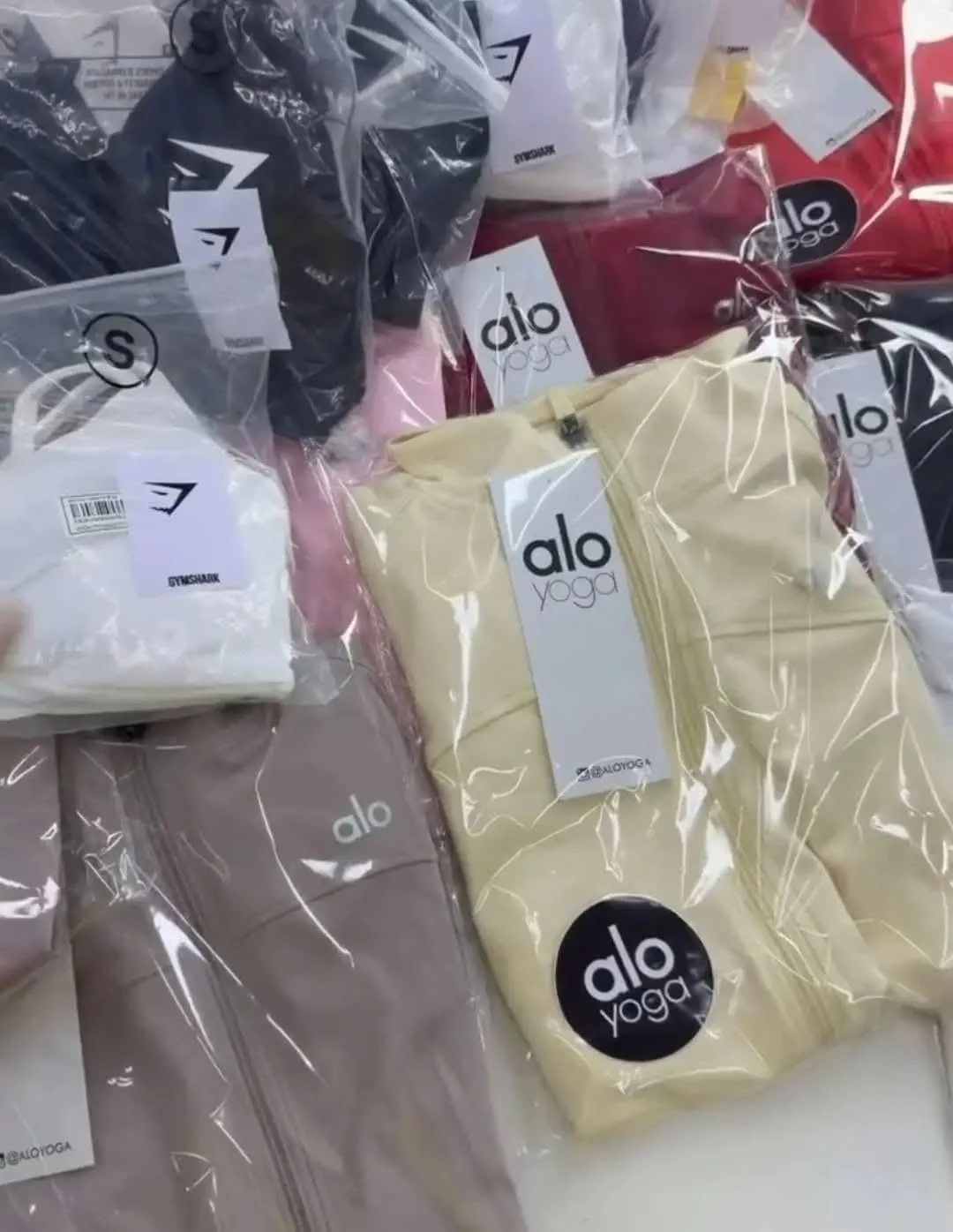 Yoga and athleisure clothing liquidation pallet with leggings, sports bras, tops, and joggers