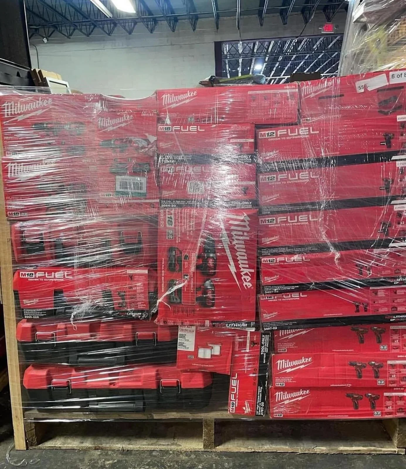 Milwaukee power tools liquidation pallet with assorted cordless drills and impact drivers