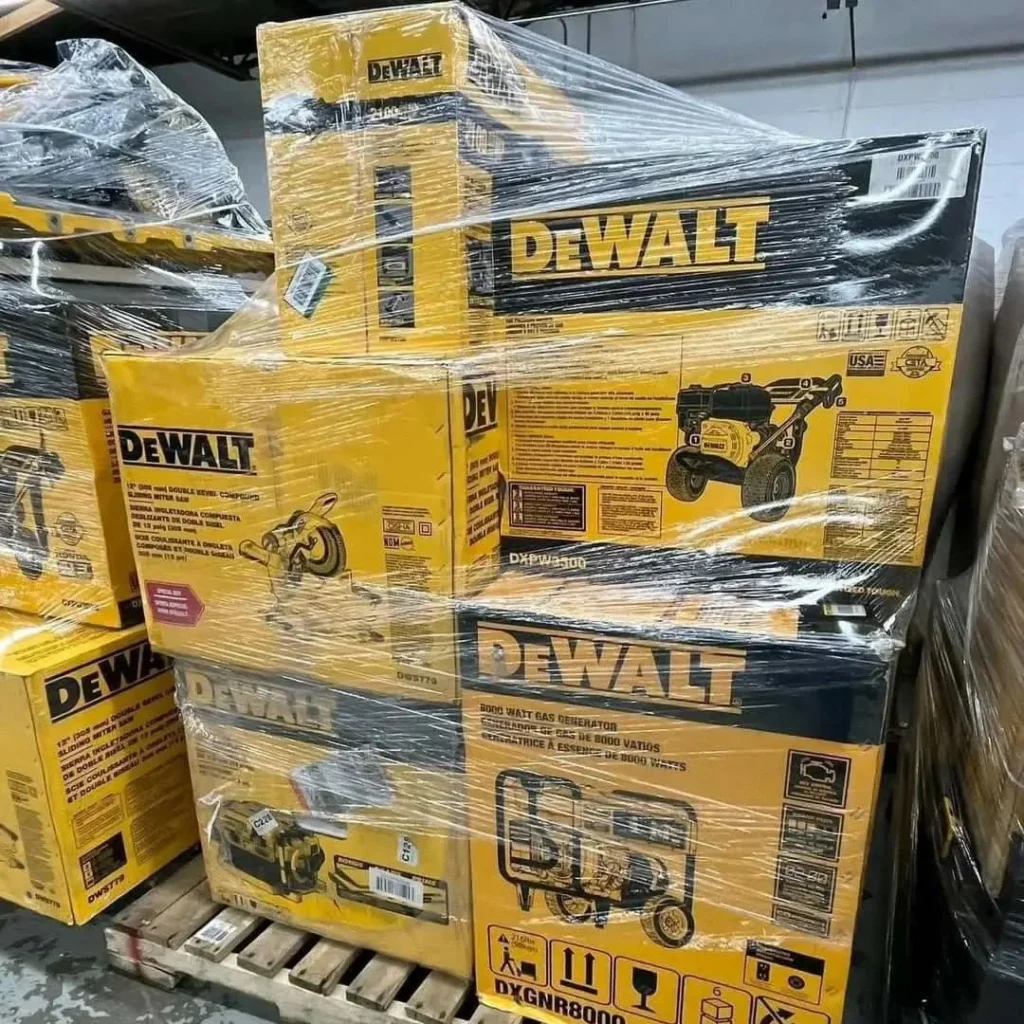 DEWALT power tools liquidation pallet with assorted drills, impact drivers, saws, batteries, chargers, and accessories