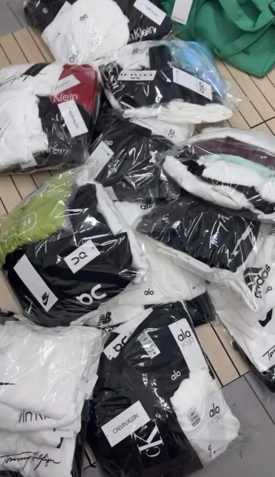 Yoga and athleisure clothing liquidation pallet with leggings, sports bras, tops, and joggers