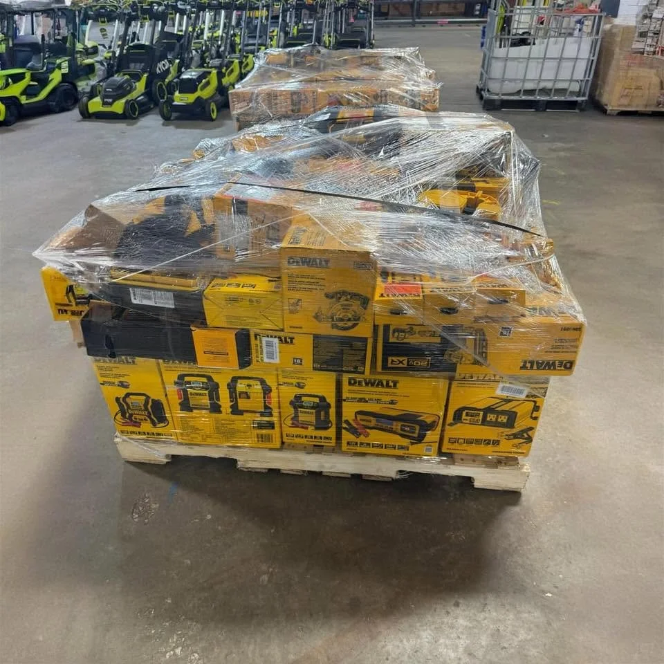DeWalt tool liquidation pallet with assorted cordless drills, impact drivers, saws, and power tools.