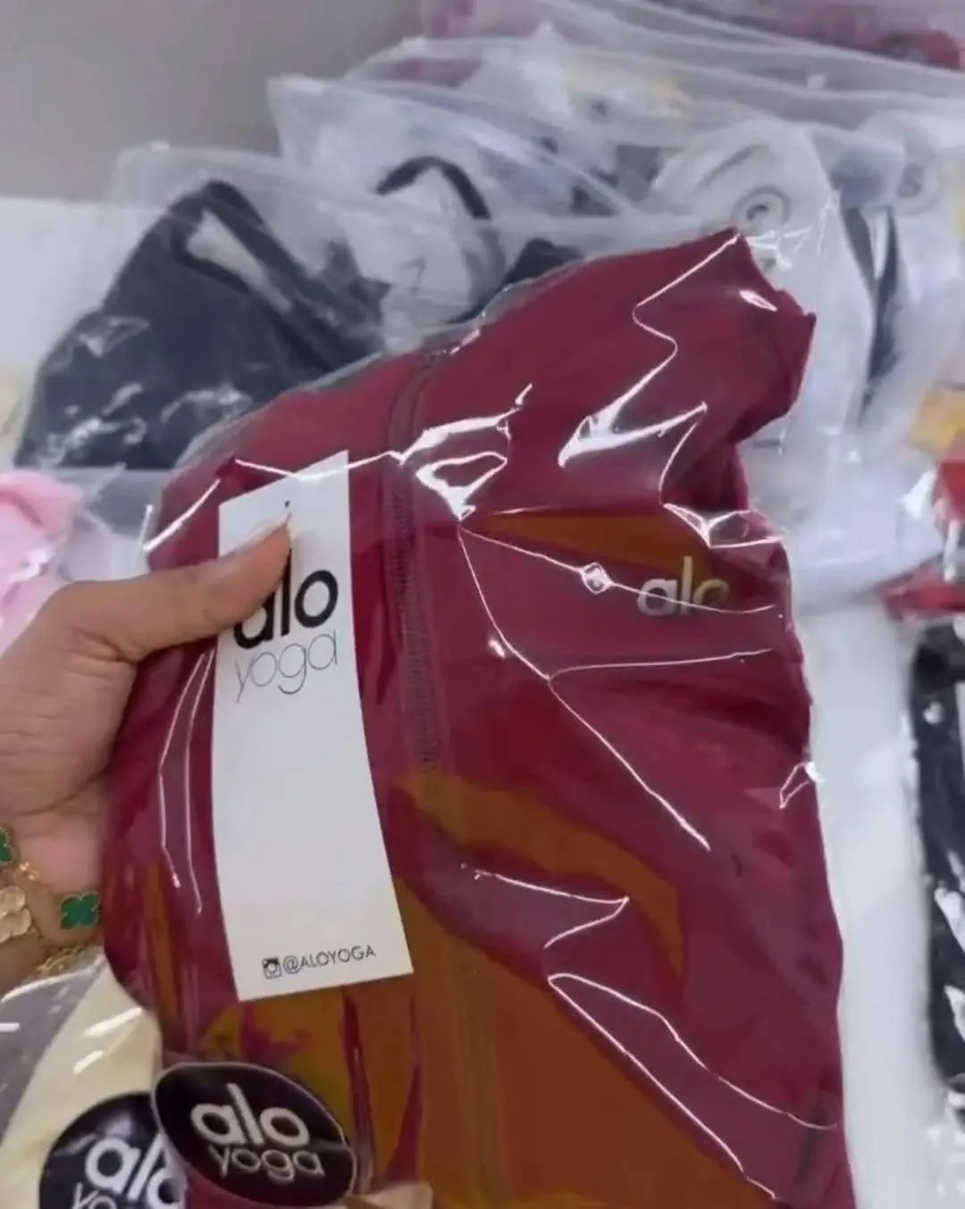 Yoga and athleisure clothing liquidation pallet with leggings, sports bras, tops, and joggers