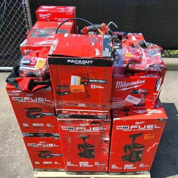 Wholesale Milwaukee tool assortment with batteries, chargers, work lights, and power-tool accessories.