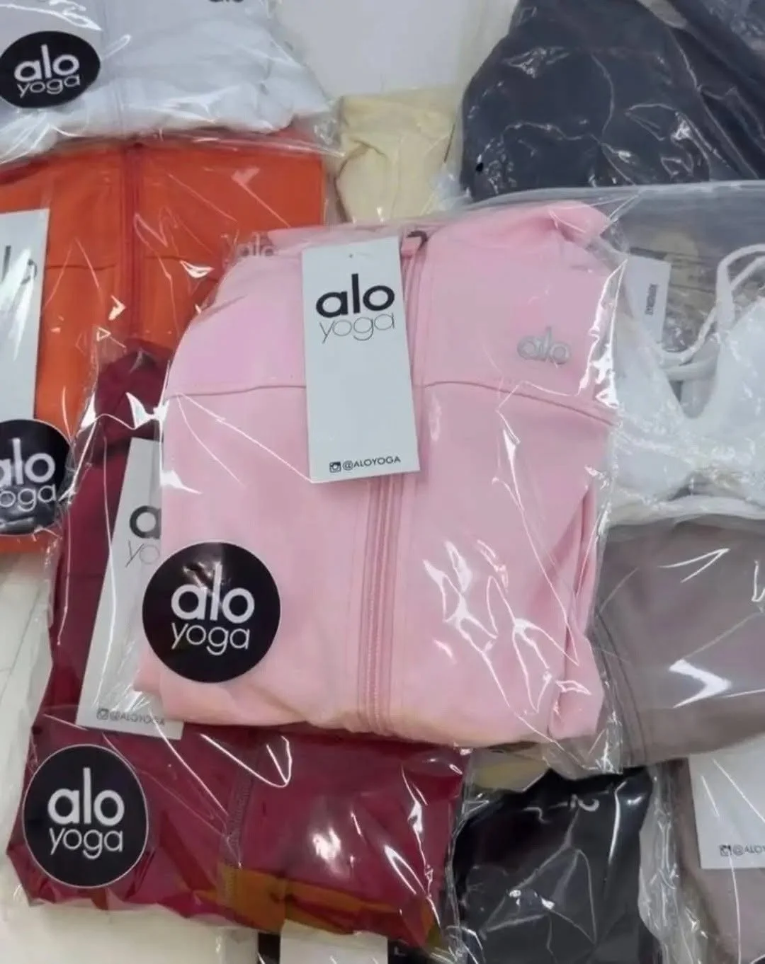 Yoga and athleisure clothing liquidation pallet with leggings, sports bras, tops, and joggers