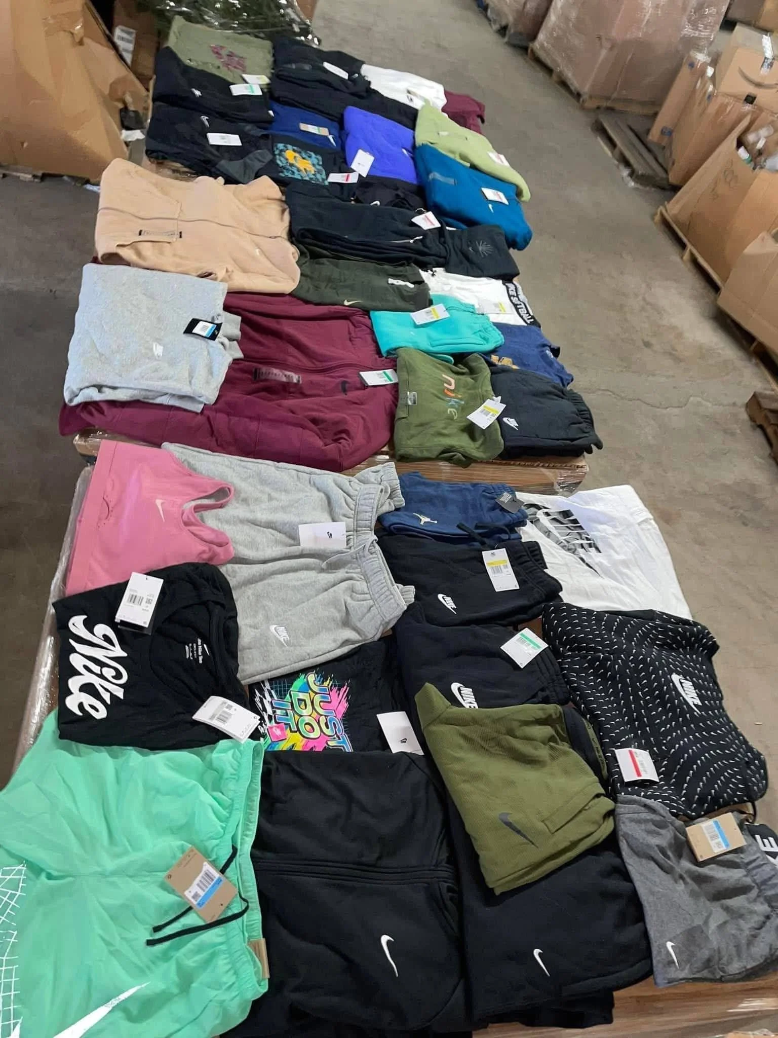 Nike athletic apparel liquidation pallet with assorted sportswear for wholesale resellers