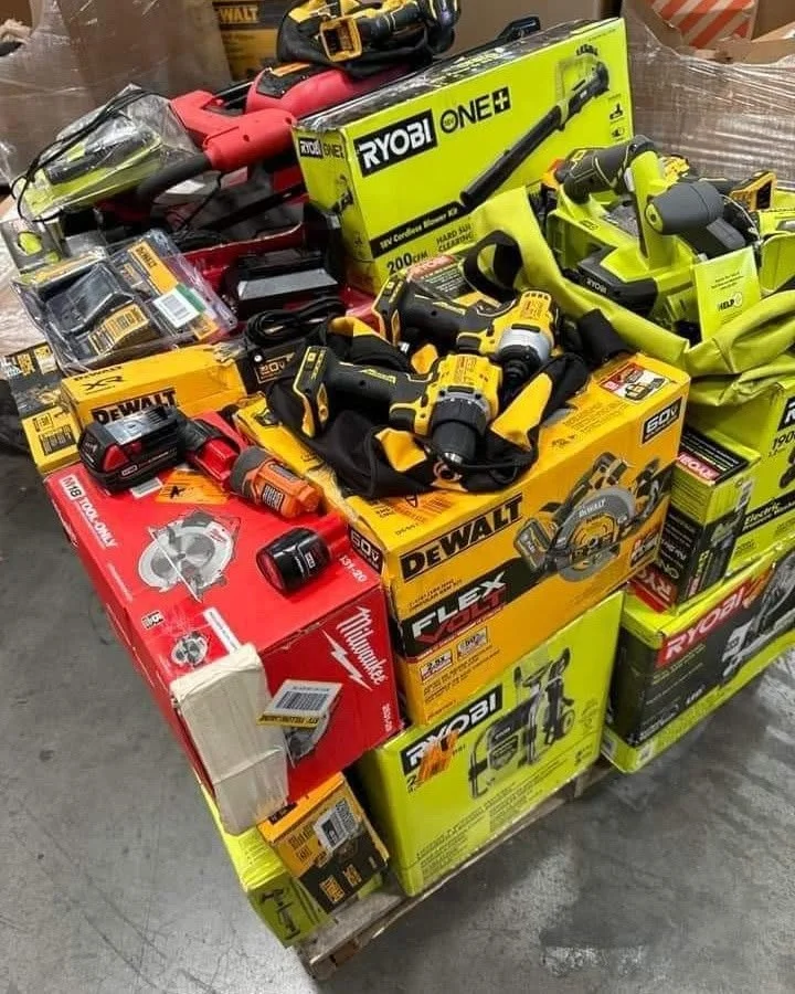 Mixed power tool liquidation pallet with cordless drills, impact drivers, saws, grinders, batteries, and accessories