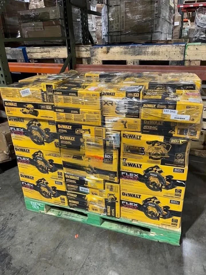 Mixed power tool liquidation pallet with cordless drills, impact drivers, saws, grinders, batteries, and accessories