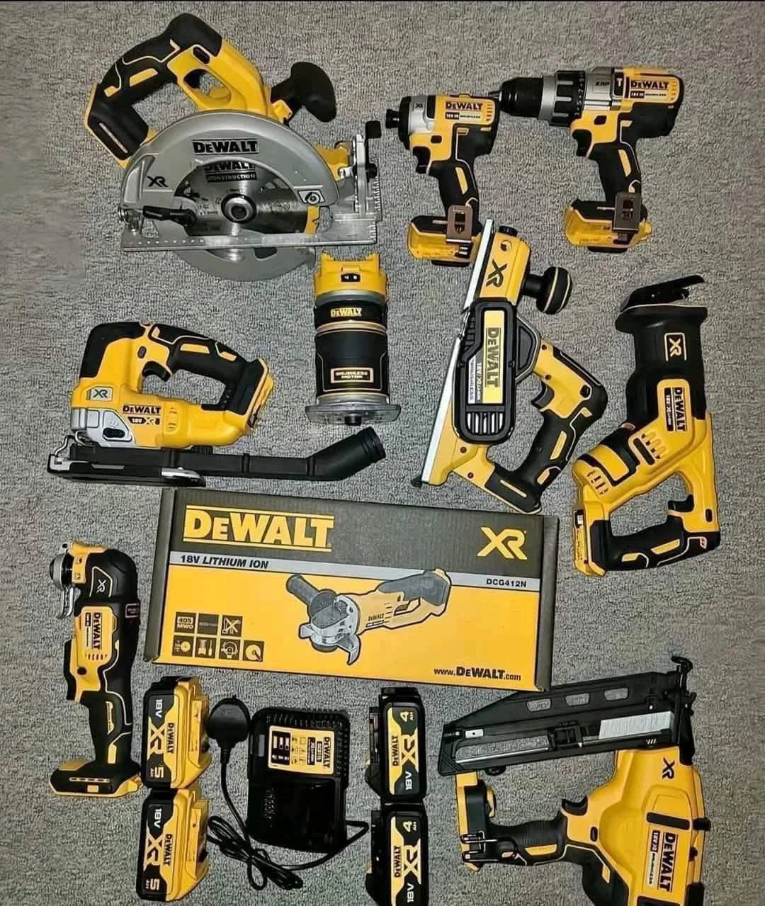 Mixed power tool liquidation pallet with cordless drills, impact drivers, saws, grinders, batteries, and accessories