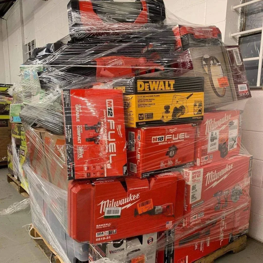 Power tools liquidation pallet with assorted cordless drills, impact drivers, circular saws, and grinders
