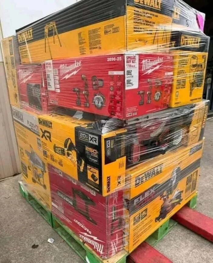 Mixed power tool liquidation pallet with cordless drills, impact drivers, saws, grinders, batteries, and accessories