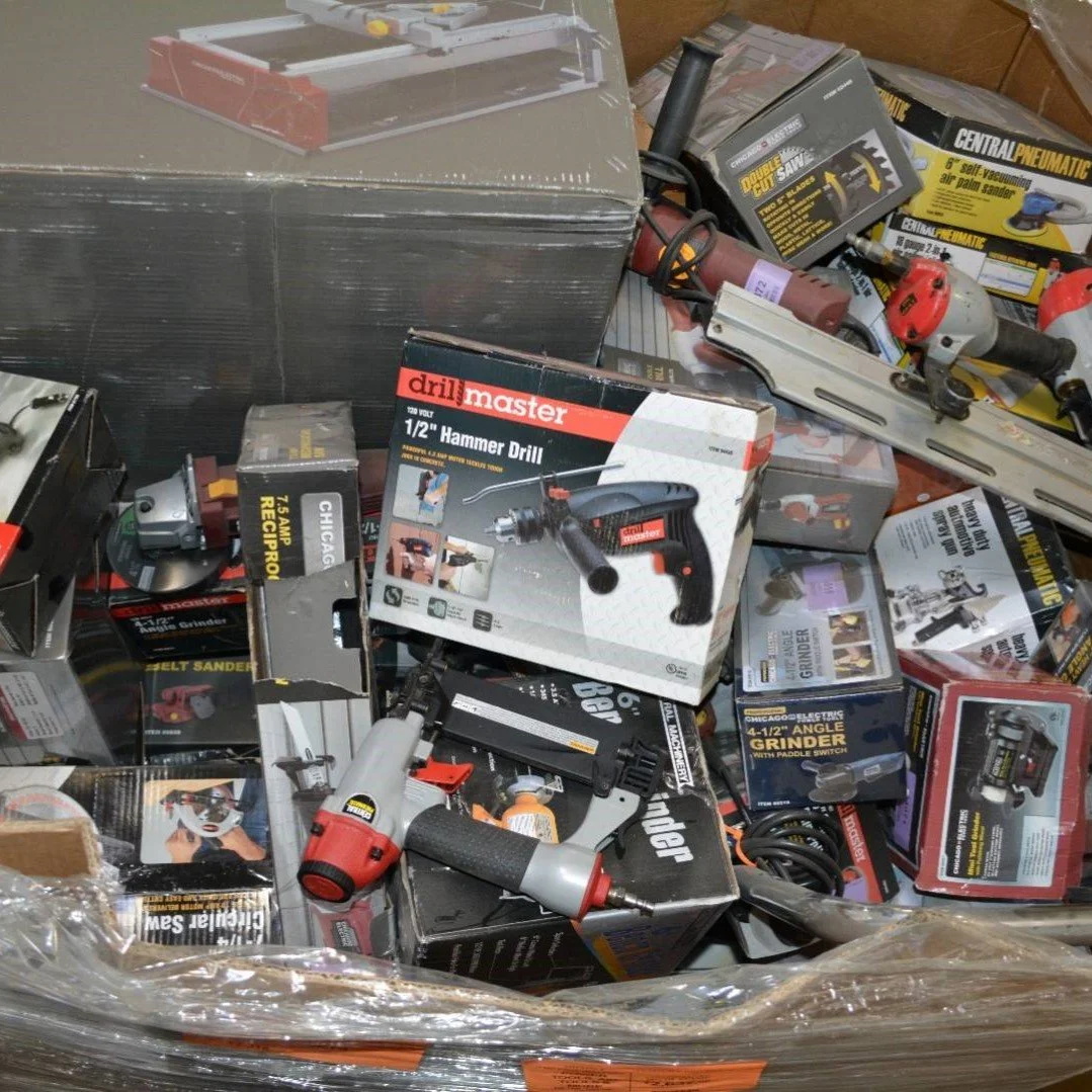 Mixed power tool liquidation pallet with cordless drills, impact drivers, saws, grinders, batteries, and accessories