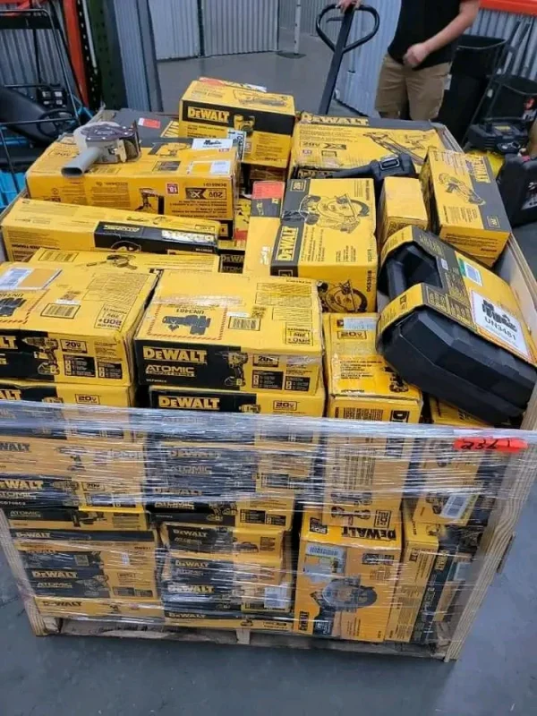 Mixed power tool liquidation pallet with cordless drills, impact drivers, saws, grinders, batteries, and accessories